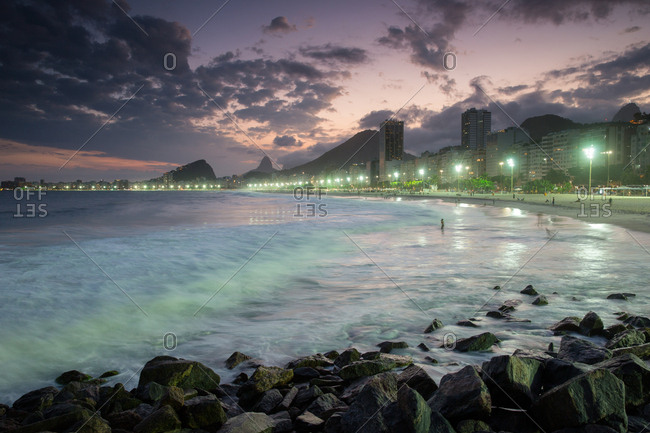 Copacabana Beach in Rio de Janeiro at dusk.