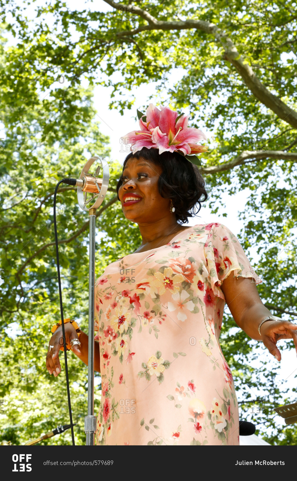 New York City, United States - June 10, 2017: 1920's Jazz
Age Lawn Party at Governors Island, Woman in vintage clothing
singing at a 1920s-themed party stock photo - OFFSET