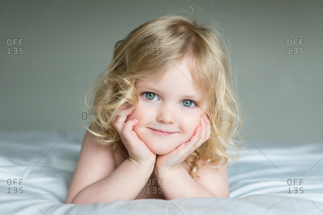 Smiling Blonde Girl With Blue Eyes Stock Photo Offset