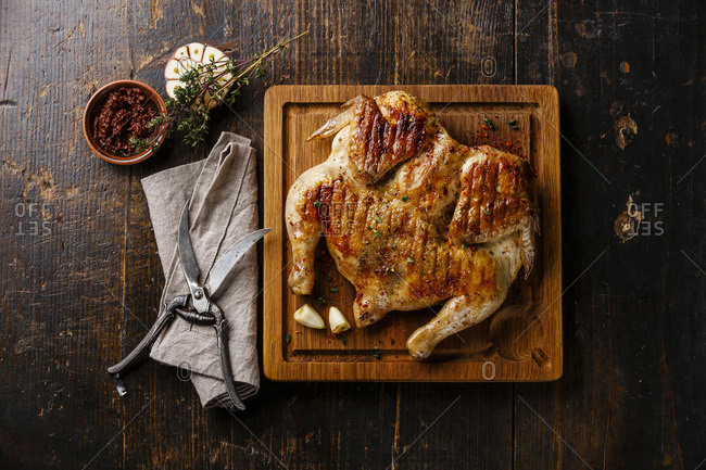 Roasted Chicken On Wooden Cutting Board Stock Photo, Picture and Royalty  Free Image. Image 46728169.