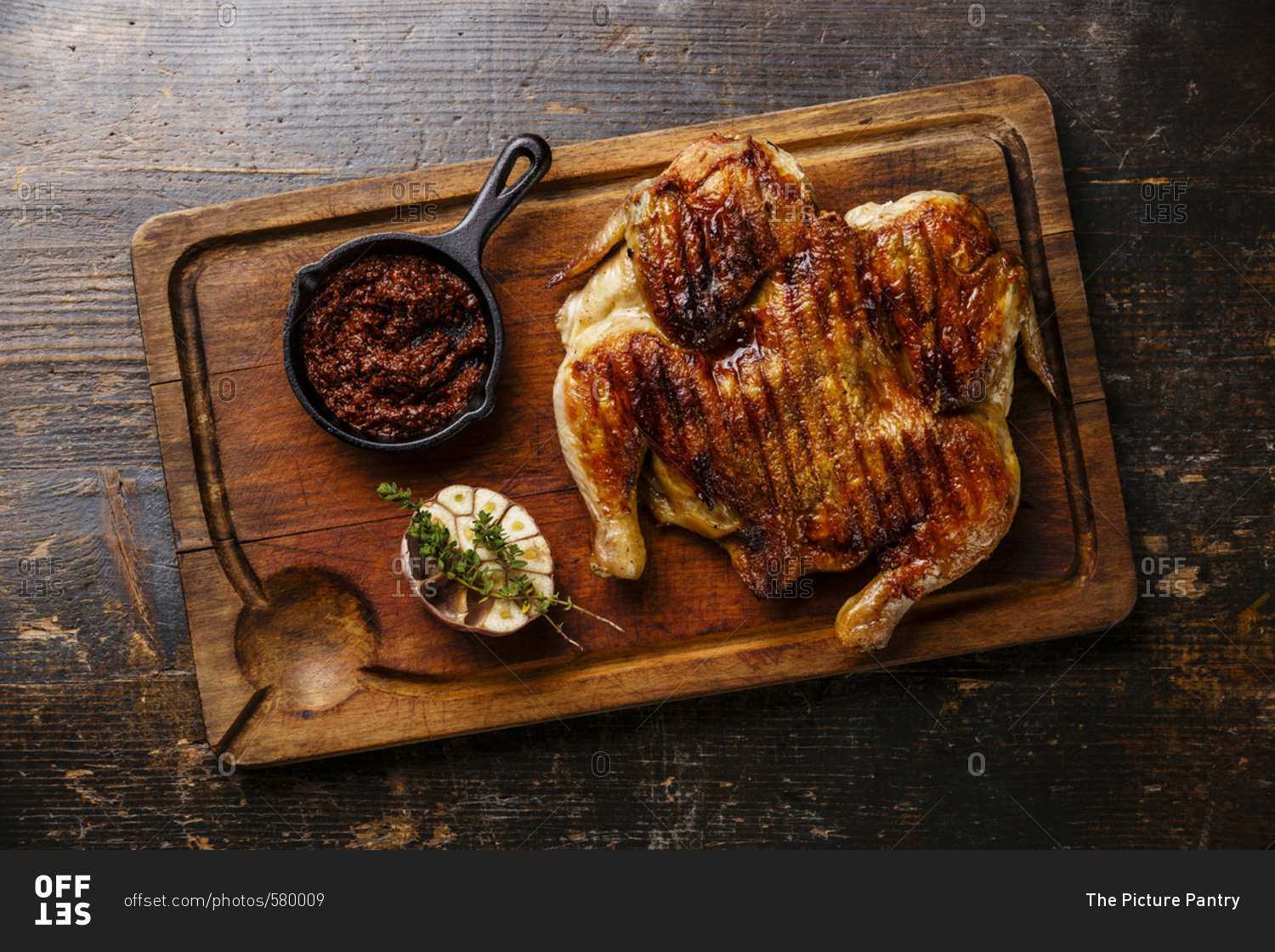 Roasted Chicken On Wooden Cutting Board Stock Photo, Picture and Royalty  Free Image. Image 46728169.