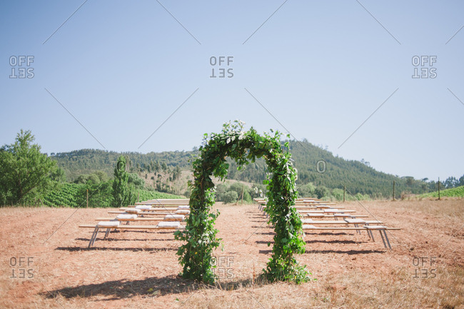 Wedding ceremony setting in vineyard
