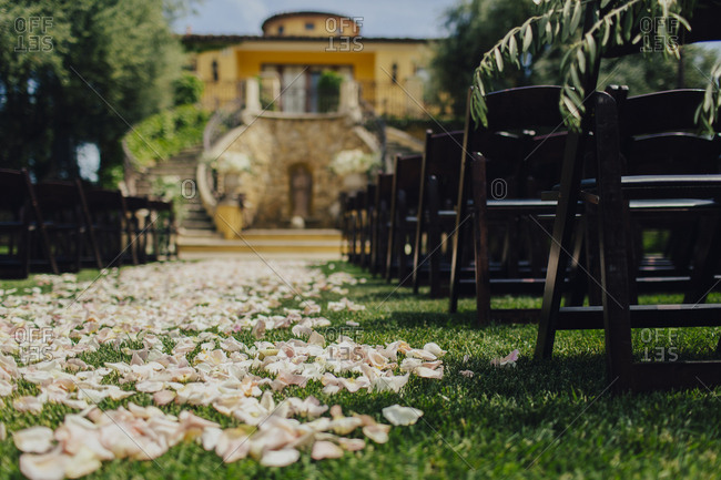 Wedding venue aisle covered in rose petals