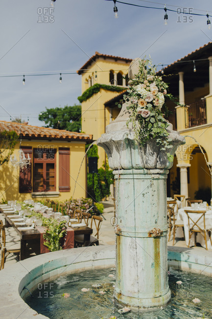 Fountain decorated with flowers for outdoor wedding