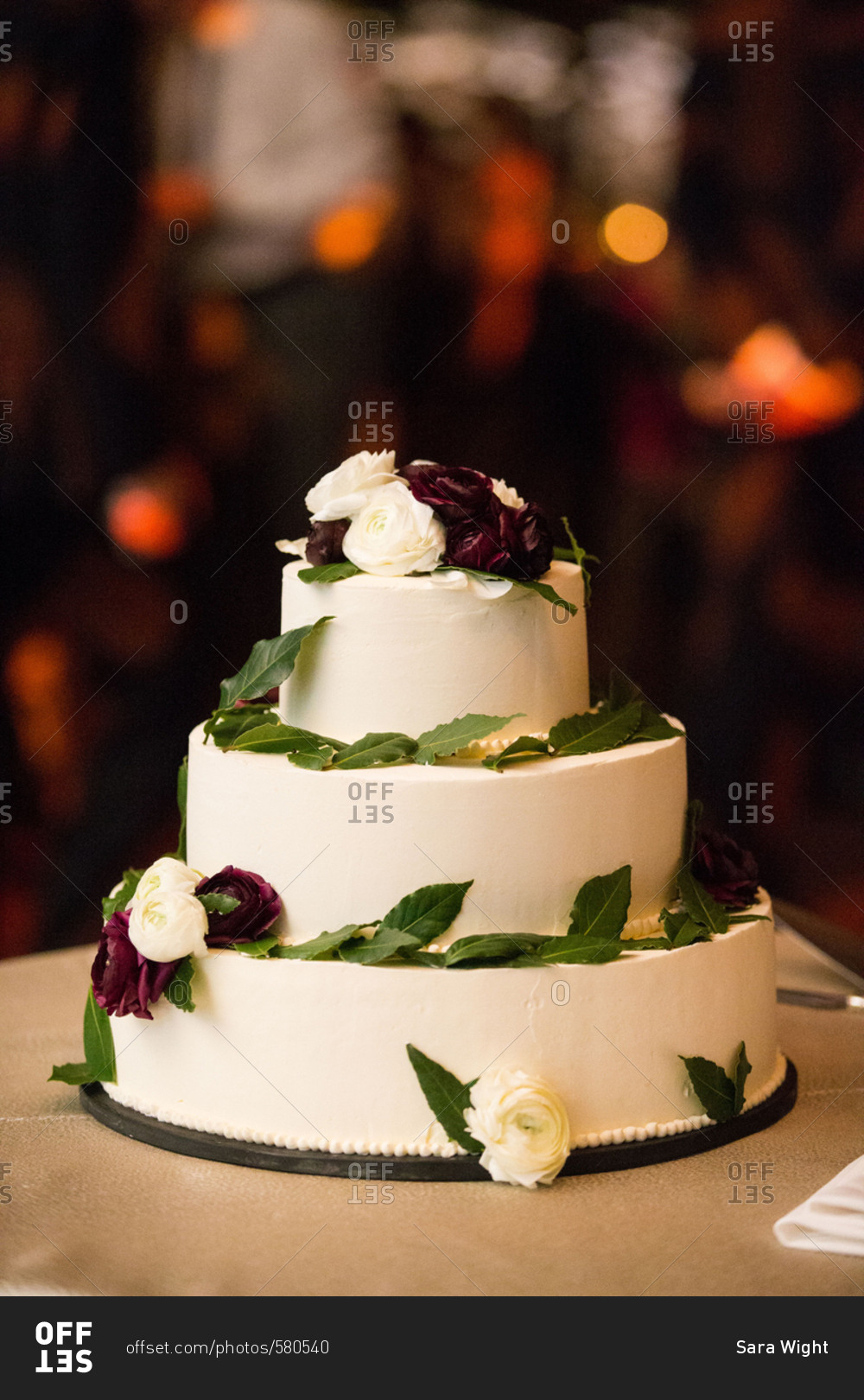 Wedding cake with roses at night