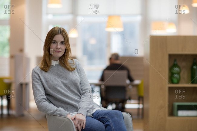 Portrait of female entrepreneur in a modern shared workplace
