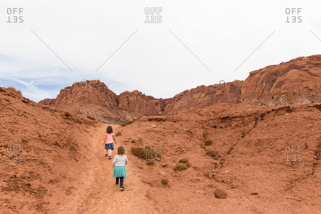 Two children climbing the trail at Capitol Reef NP, Utah