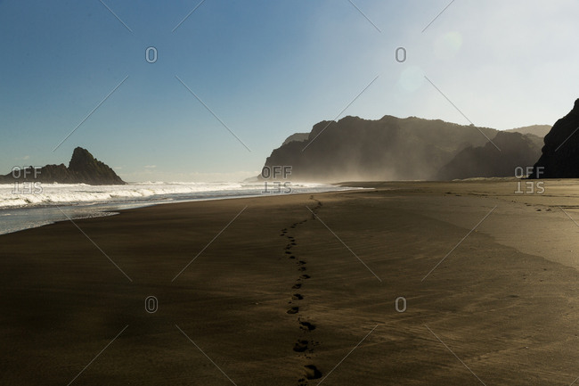 Footprints on a secluded beach
