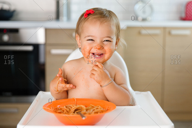Happy toddler messy from food