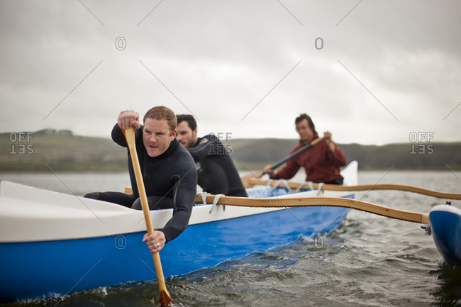 An outrigger canoe team on the water