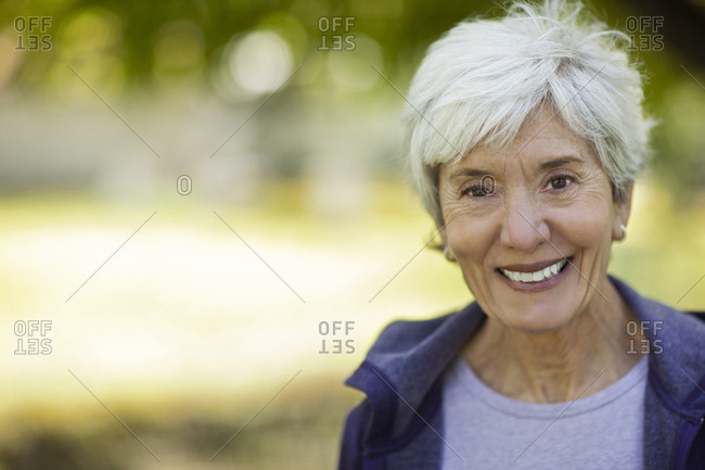A Smiling Senior Woman With Short Gray Hair Stock Photo Offset