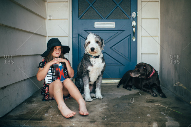 Girl with accordion and dogs
