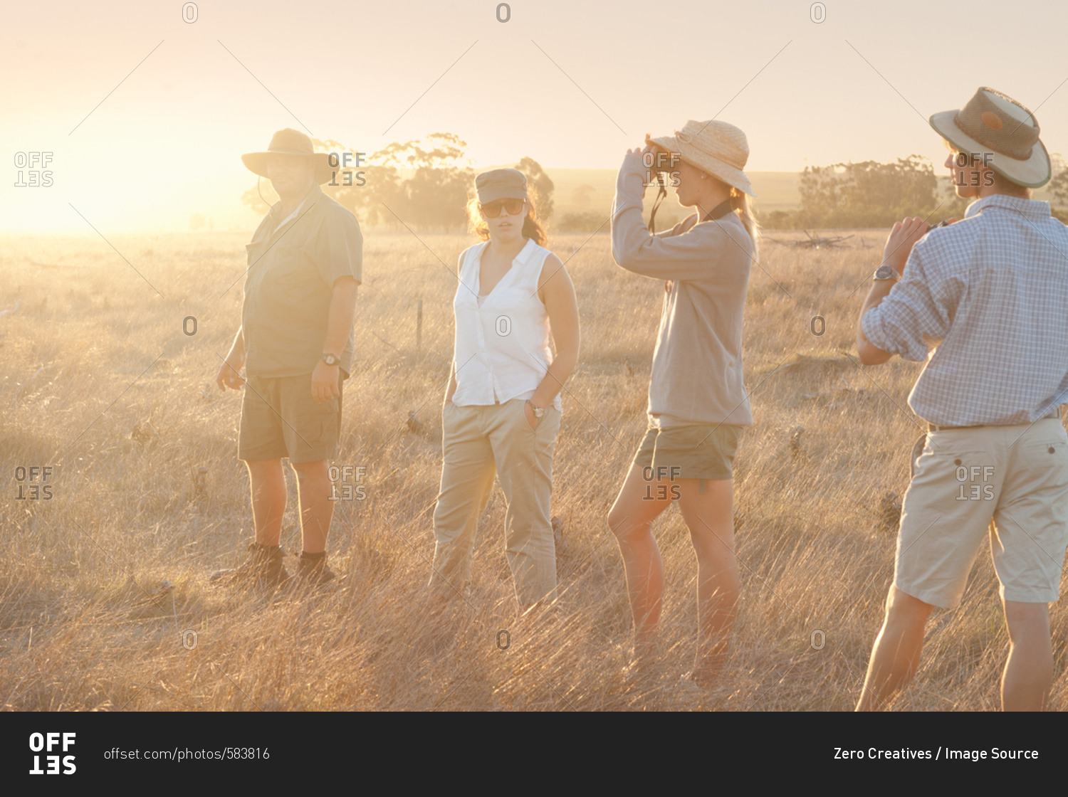 People using binoculars on a safari, Stellenbosch, South Africa