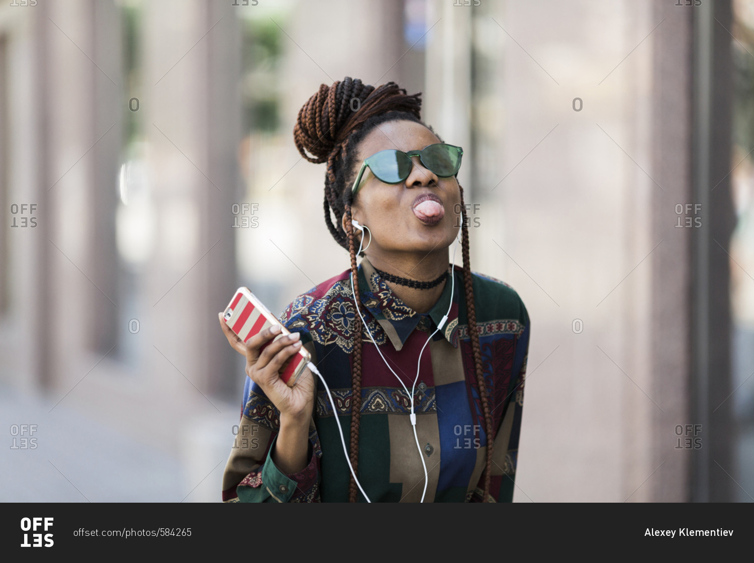Happy young african american woman on the street