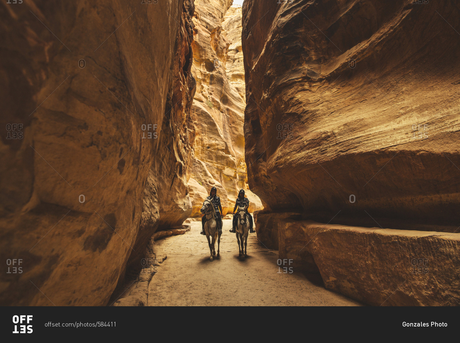 Petra, Jordan - 13, September 2015. Two police officers on horses coming  from the Siq tunnel passage, which leads into the city of Petra in Southern  Jordan stock photo - OFFSET