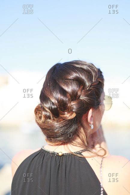 Woman In A Black Formal Gown With An Elegant Braided