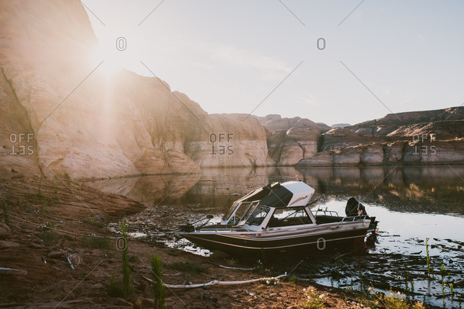 Boat on Lake Powell at sunset