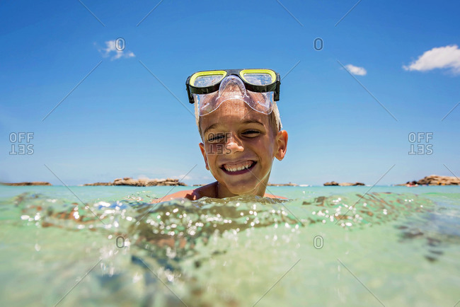 Boy grinning in a snorkel mask