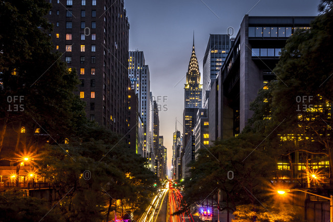 New York City, New York - July 21, 2014: Views down 42nd Street and from the Tudor City bridge at sunset, dusk and night in Manhattan in New York City, New York