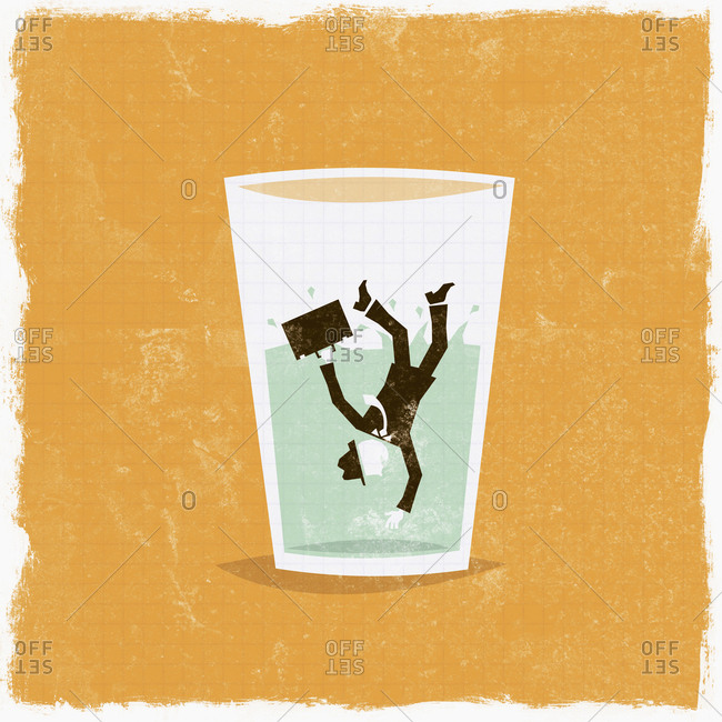 Businessman falling in glass of water