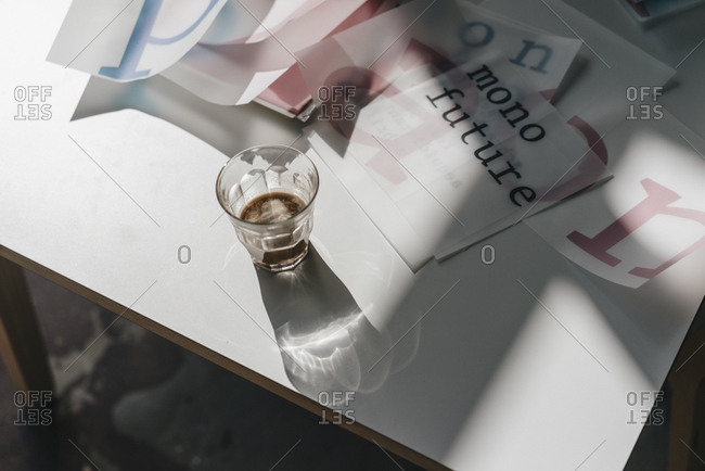 Glass and letter templates on table