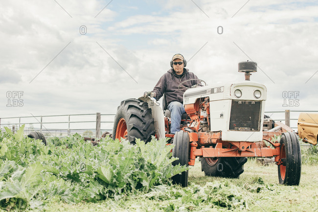 Umatilla Reservation, Pendleton, Oregon - May 17, 2017: Man riding on a tractor on the Umatilla Reservation in Oregon