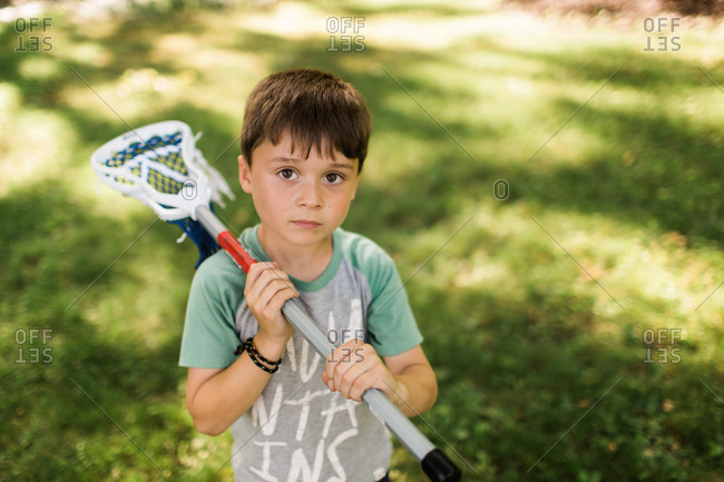 Portrait of a boy with a lacrosse stick
