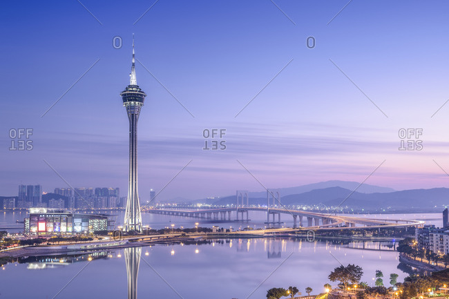 Se, Macau, China - December 20, 2014: Macau Tower and Sai Van Bridge at dusk