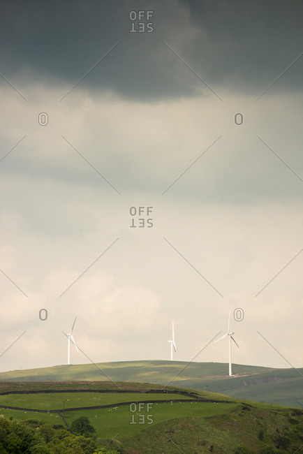 Wind turbines among rolling hills