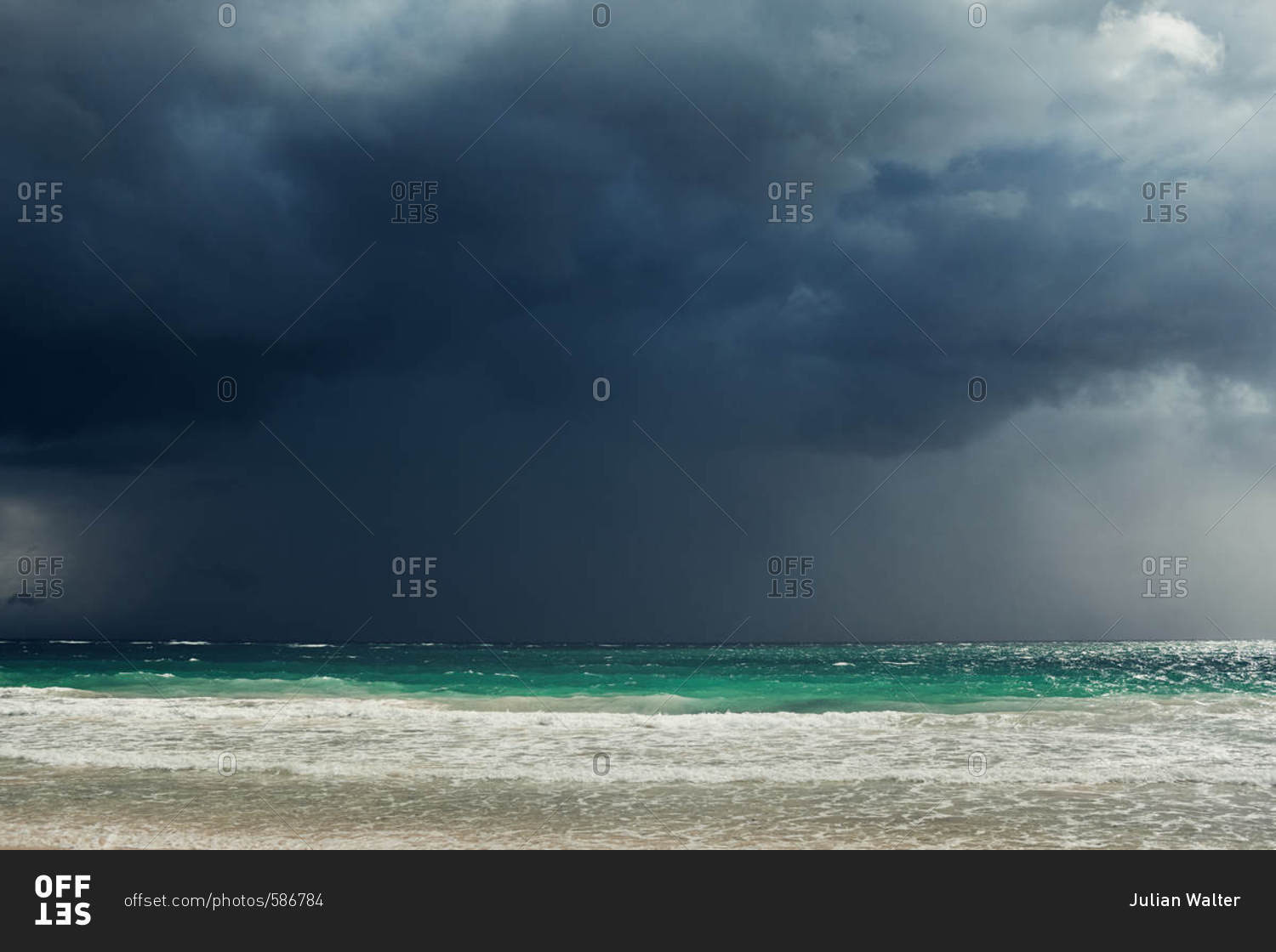 Turquoise water under stormy sky on the coast of Tulum, Quintana Roo, Mexico