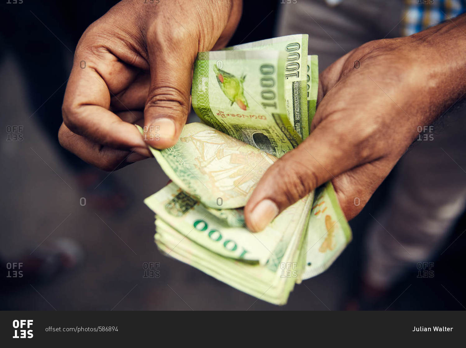 Person counting money in Sri Lanka