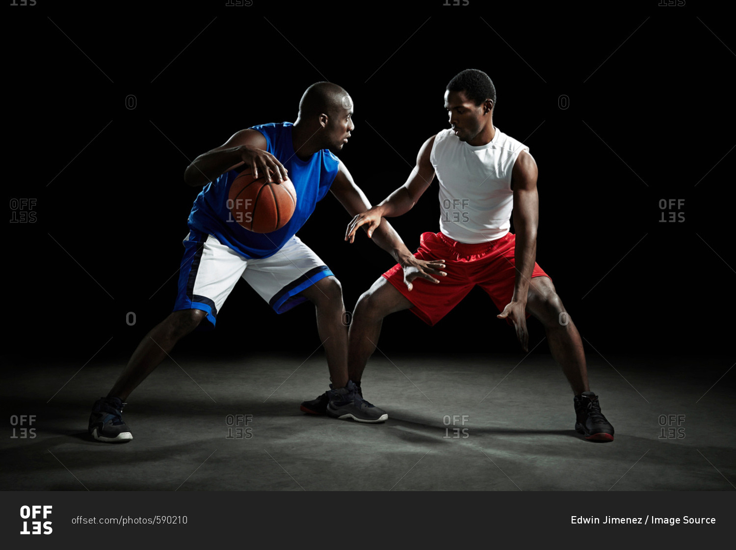 Basketball players competing for ball