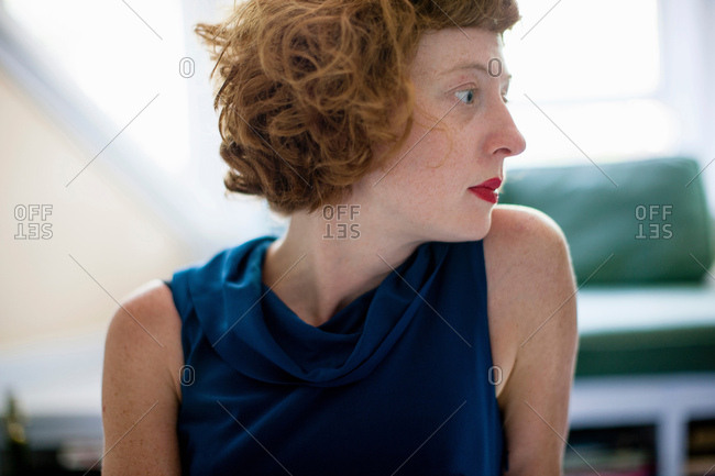 Close up profile of woman in sitting room