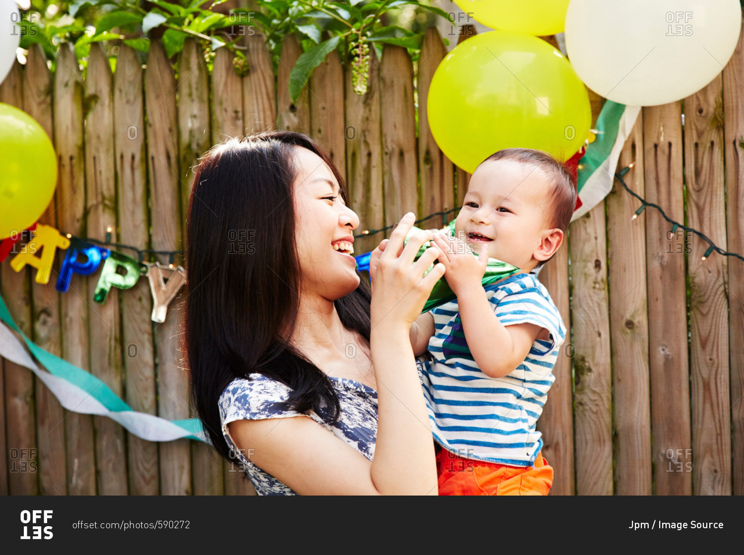 Mother and son at birthday party laughing