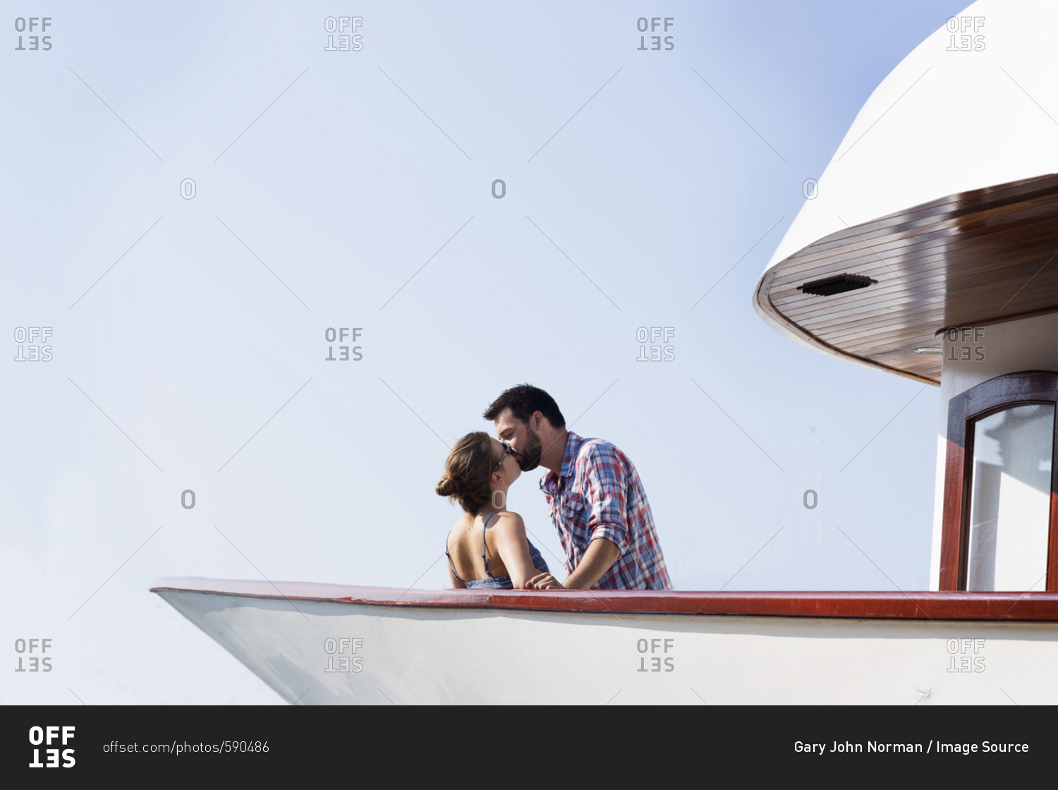 Young couple kissing on boat, Milna, Brac, Croatia
