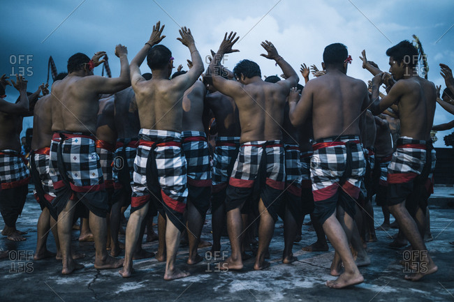 4/4/17: A traditional kecak performance overlooking the ocean at dusk at Ulawatu Temple in Bali, Indonesia.