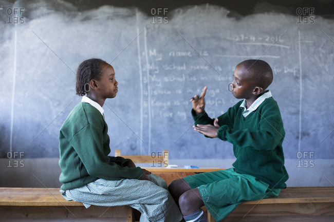 Isiolo, Samburu, Kenya - April 26, 2017: Hearing impaired girl and boy, learning sign language at the Isiolo School for the deaf