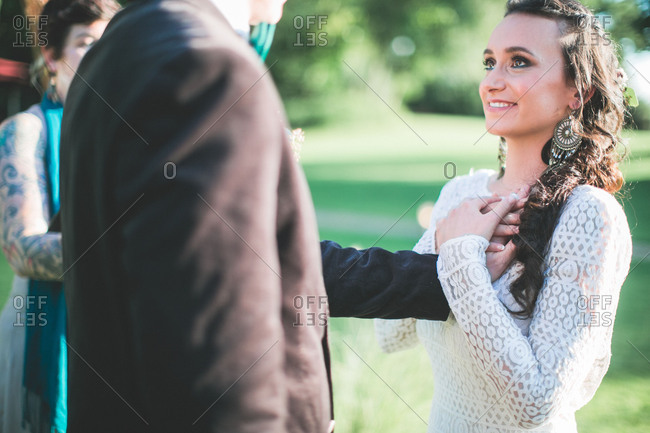 Alternate bridal couple at spiritual wedding ceremony outdoors, lover's vow, ceremony, portrait