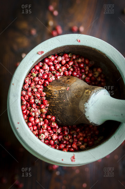 Red peppercorns in a mortar