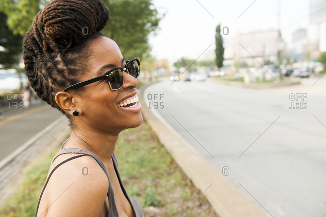Curvy beautiful African American woman with braids in lingerie keeping  hands on waist and looking at camera against yellow background stock photo  - OFFSET