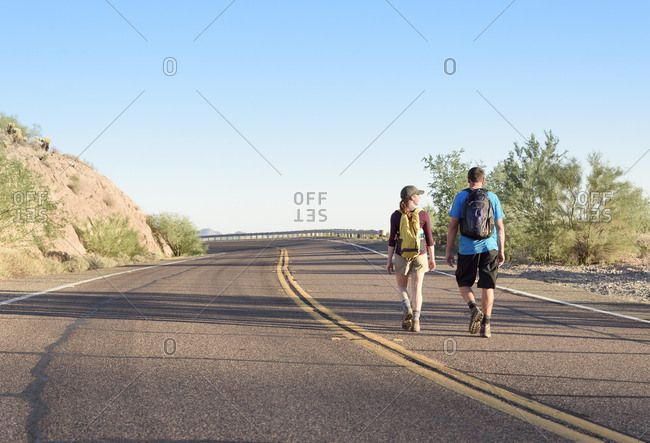 Couple hiking on winding street