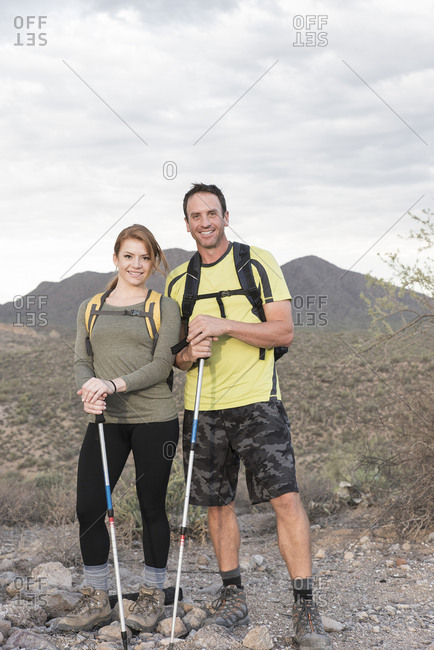 Portrait of smiling couple hiking in desert