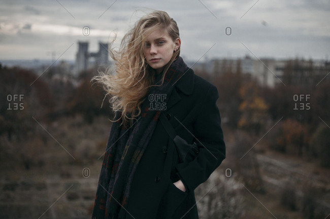 Portrait of Caucasian woman with hair blowing in wind stock photo - OFFSET