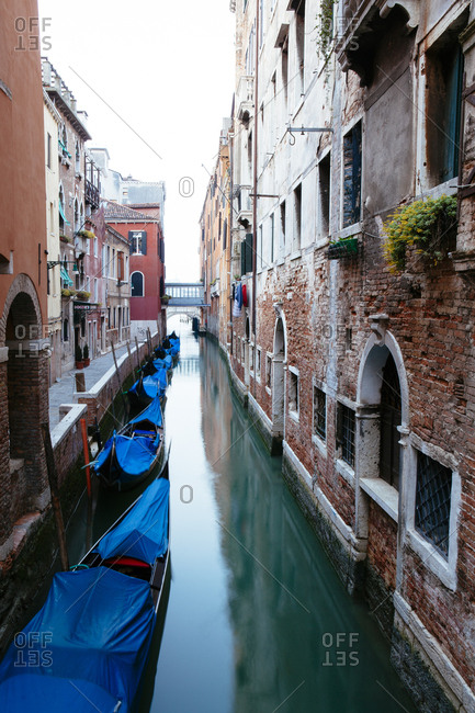 Venice, Italy - May 8, 2010: Covered gondolas in the early morning in Venice Italy