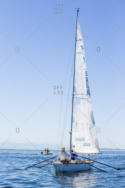 Victoria, British Columbia, Canada - July 21, 2017: Racers riding boat leaving victoria for the second leg in the race to alaska