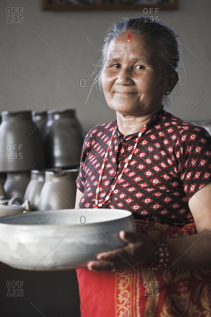 Thimi, Bagmati, Nepal - May 28, 2009: Portrait of smiling woman at thimi ceramics in nepal