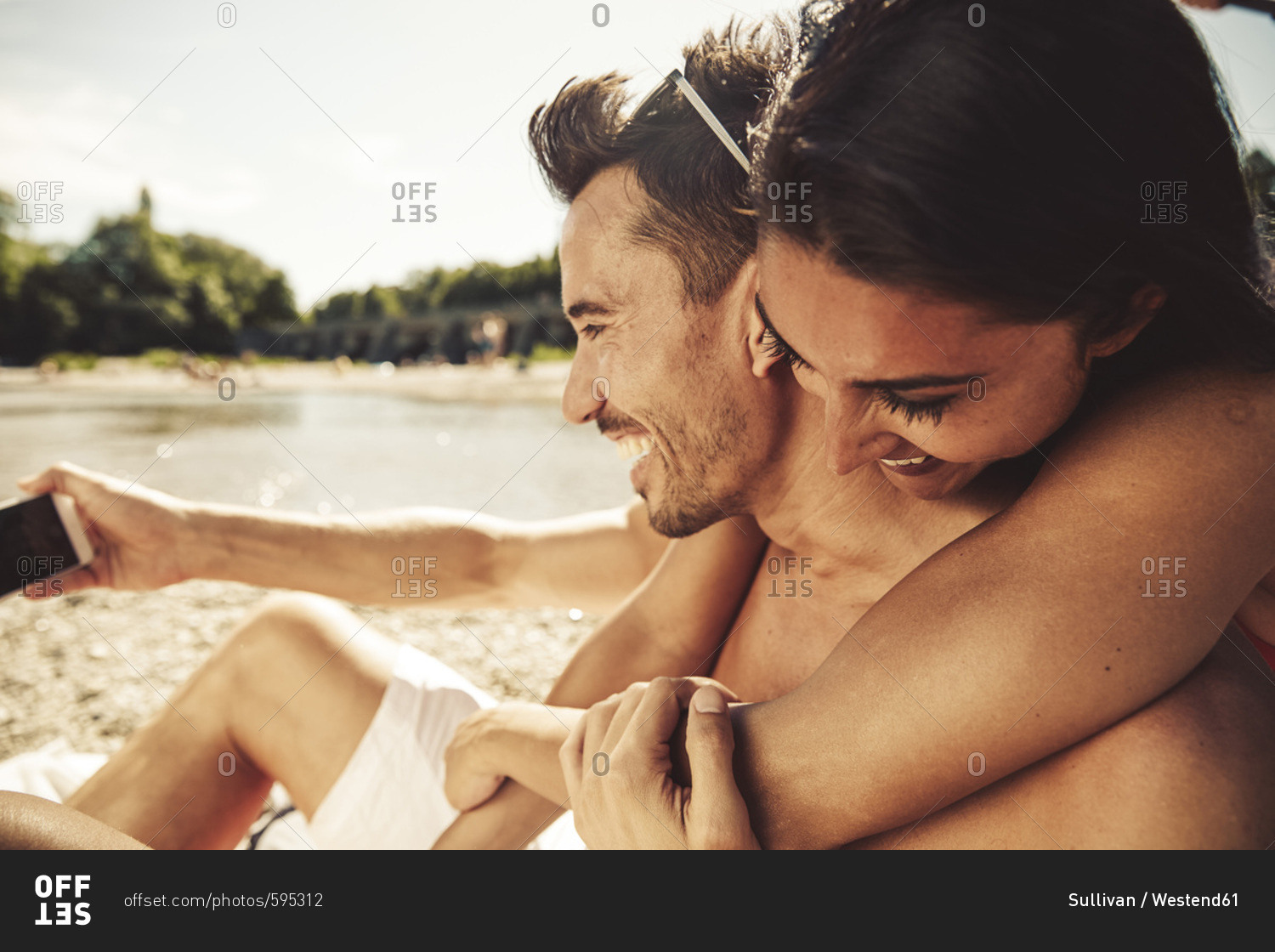 Couple in love taking selfie on the beach