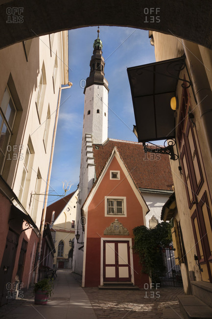 One of Tallinn, Estonia's many arch passageways frames some of the Old Town district's medieval architecture, including the spire of the Holy Spirt Lutheran Church. Founded in 1248, Tallinn is among Europe's best preserved medieval cities.