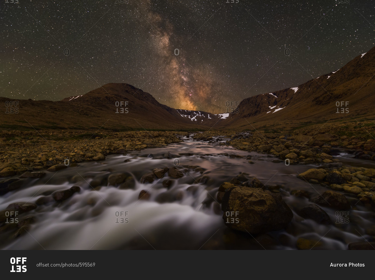 The Milky Way over cascades in a seasonal river in The Tablelands of Gros Morne National Park in Newfoundland.