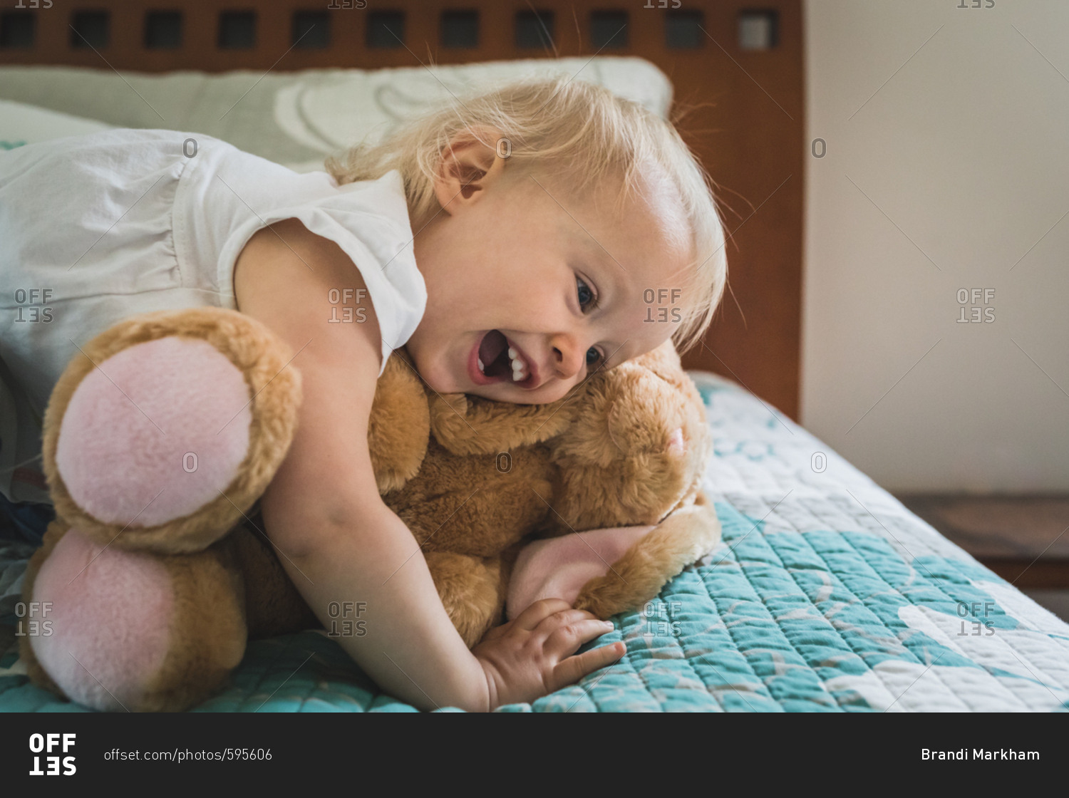 Baby girl hugging stuffed animal